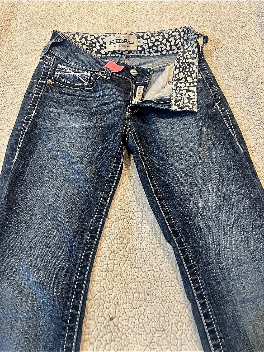 Ariat R.E.A.L. Low Rise Stretch Rosy Whipstitch Boot Cut Jean. Rosy Whipstitch